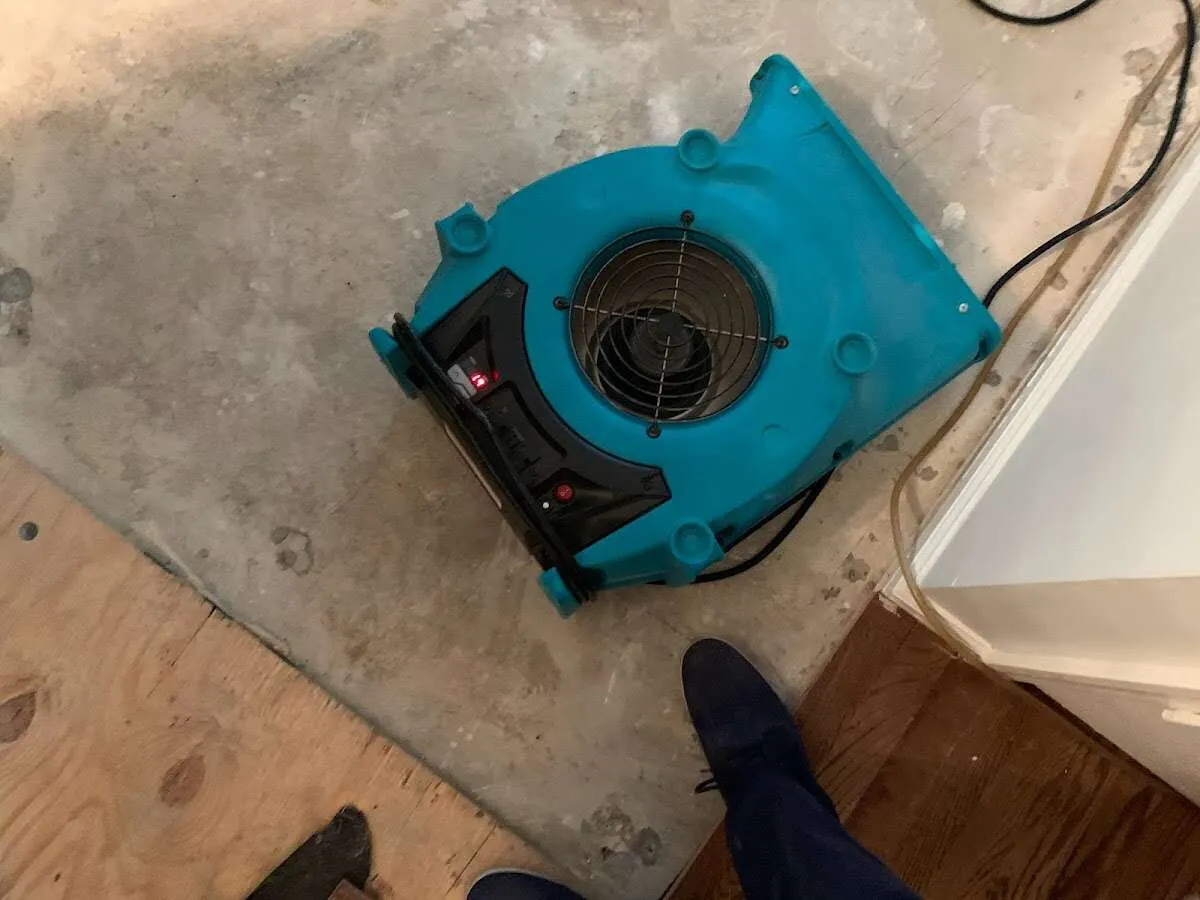 Air mover drying subfloor during Commercial Water Damage Restoration in Mint Hill
